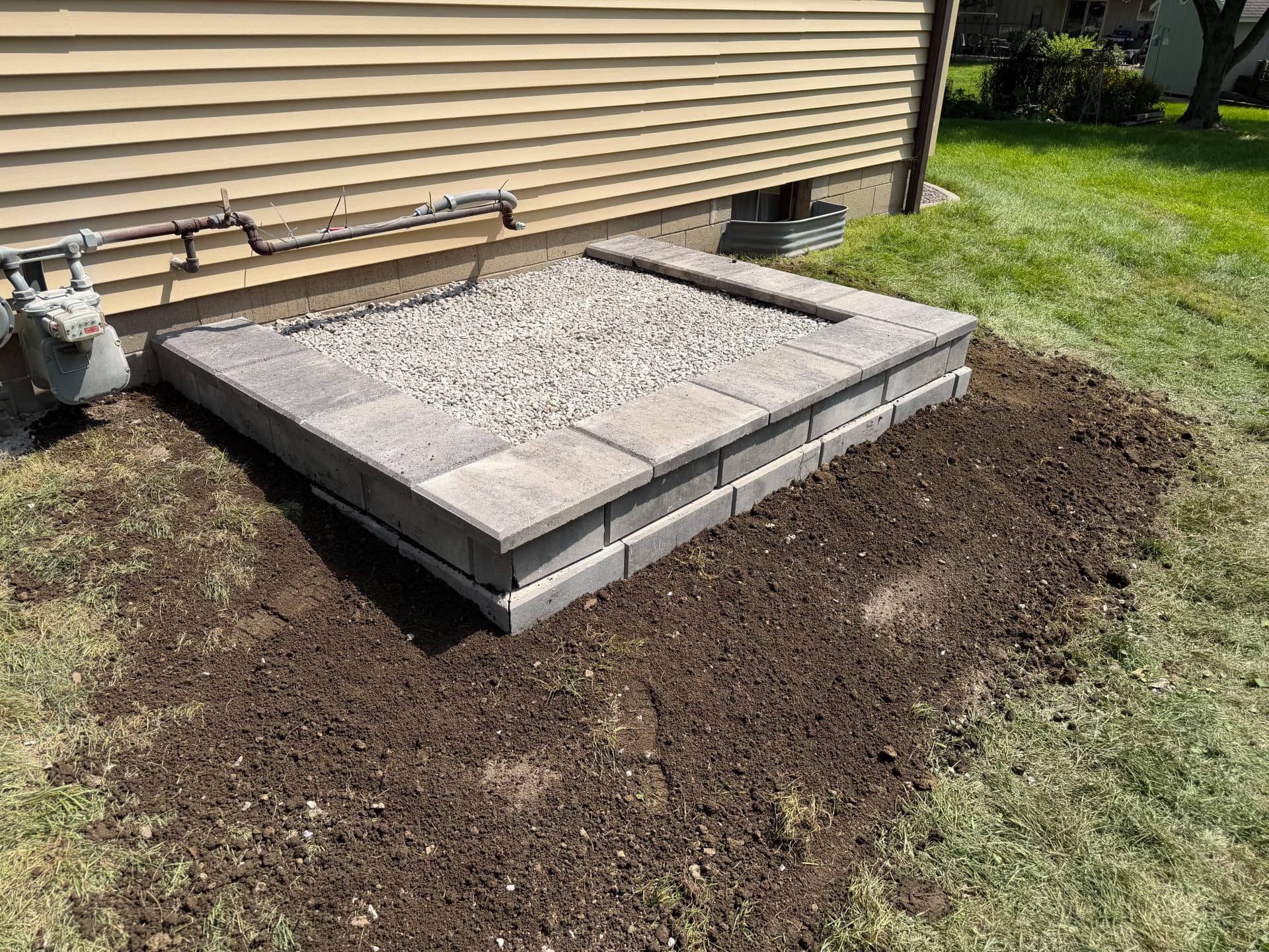Retaining Wall and Generator Pad Done Right image