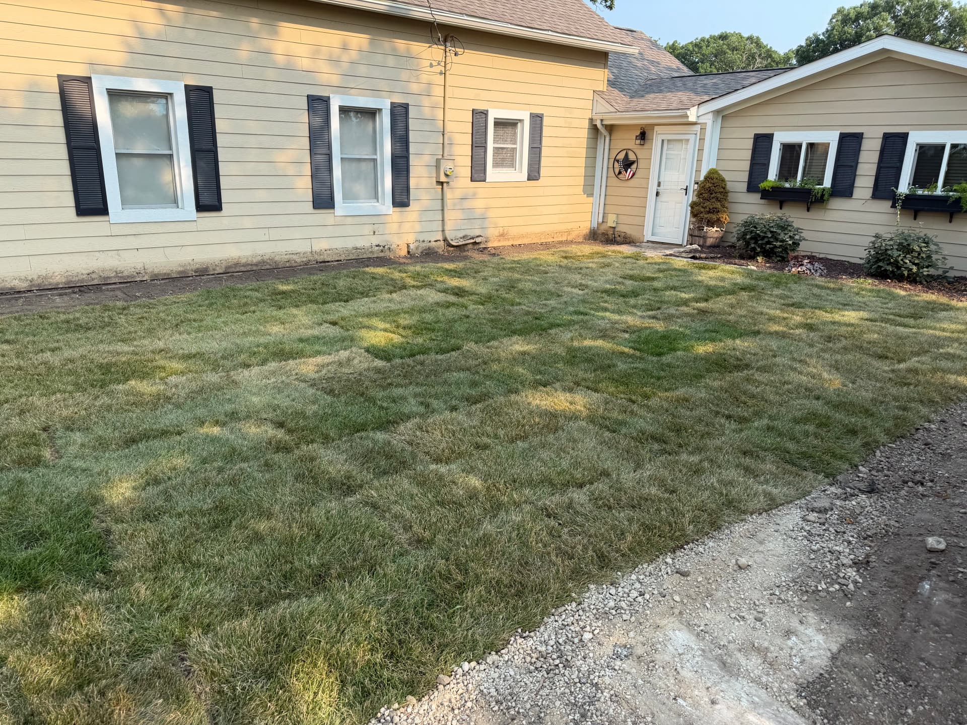 Gallery photos for Fresh Grade and Sod Install Turns a Rough Yard Into a Usable Space: Image #2